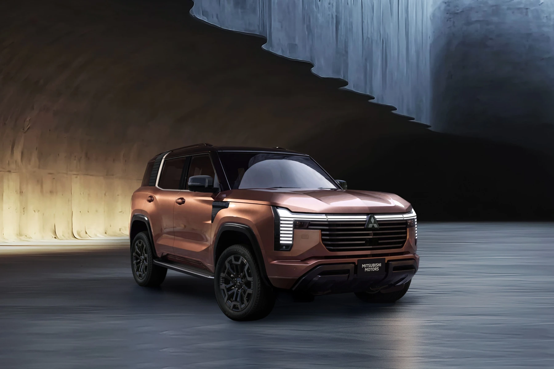 Official Mitsubishi press image of the all-new Pajero in a copper finish, shown from the front three-quarter angle